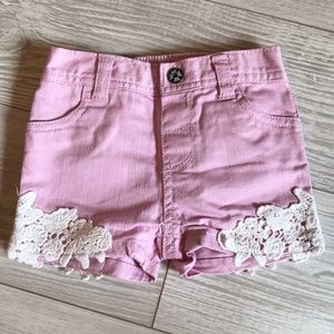 Little girls pink shorts with crochet detail